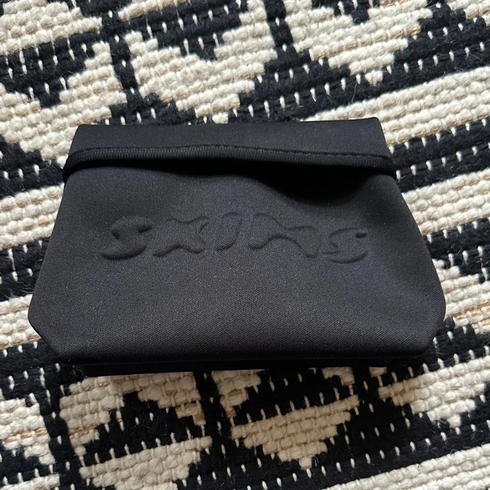 SKIMS Black Embossed Pouch